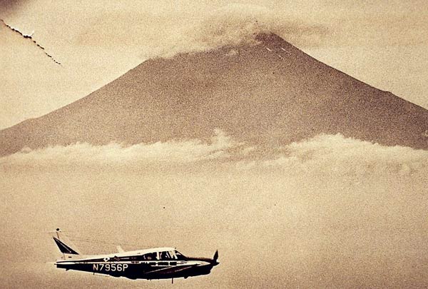 Henry Ohye's Toku-Hana (Piper Comanche N7956P) With Mt. Fuji in the Background, ca 1964 (Source: Ohye family)